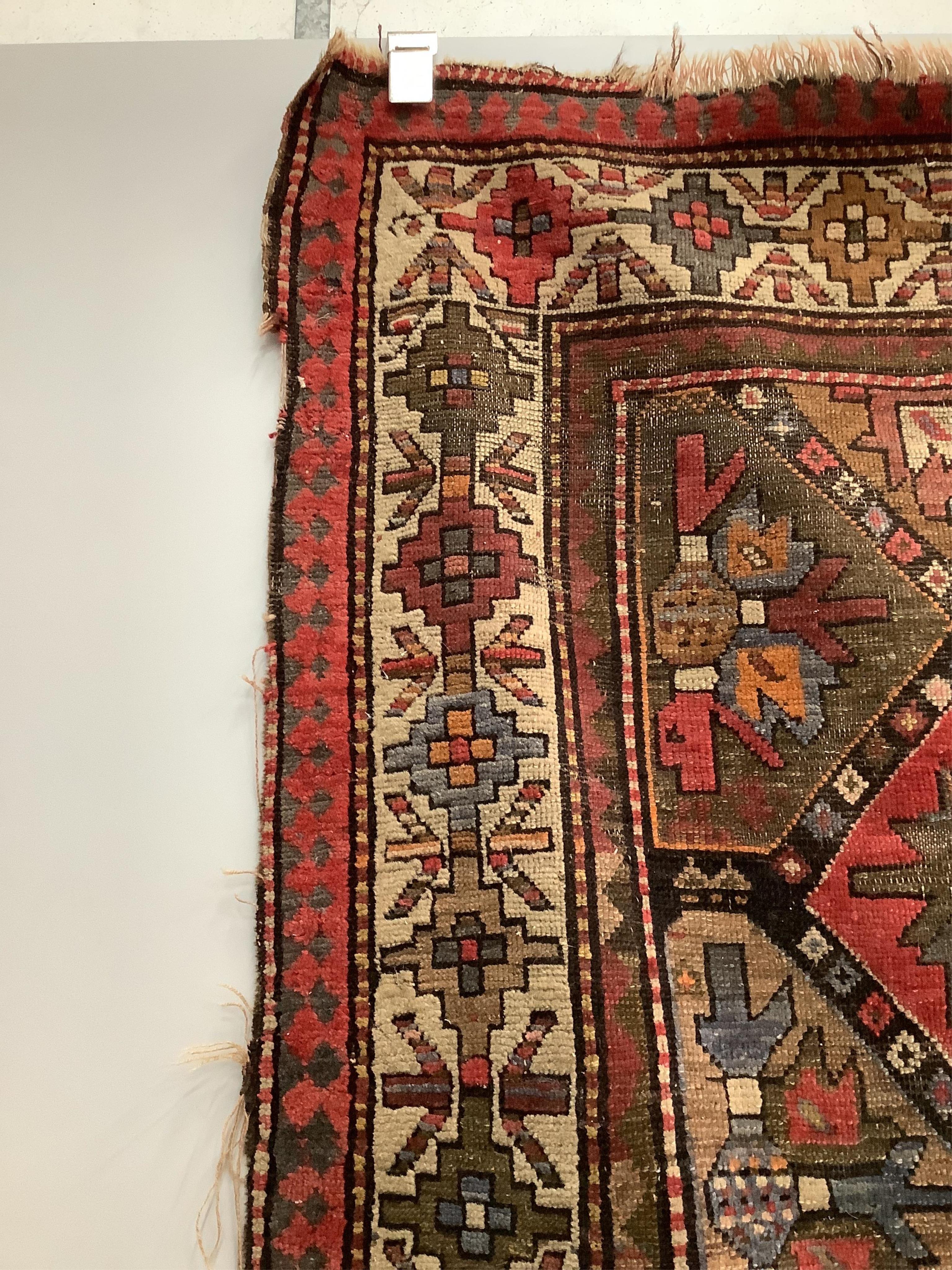 An antique Caucasian geometric rug, 250 x 140cm, together with a Belouch prayer rug, 130 x 78cm. Condition - poor